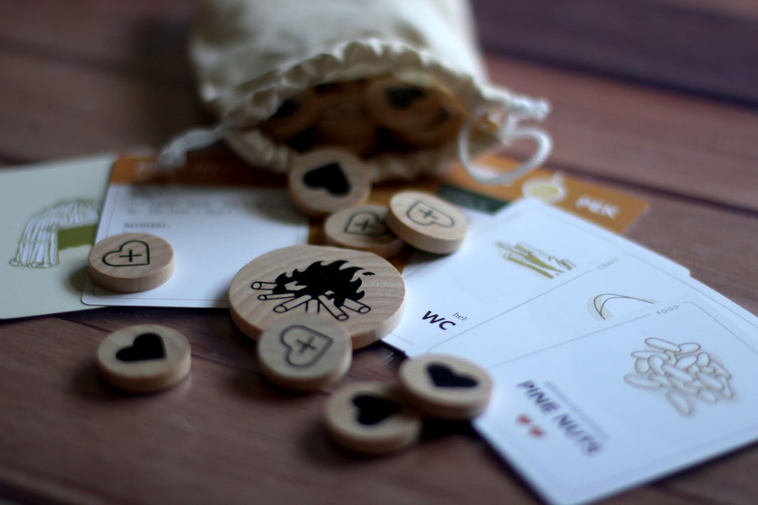 a-bunch-of-wooden-buttons-sitting-on-top-of-a-table-5q7xnm73wv8